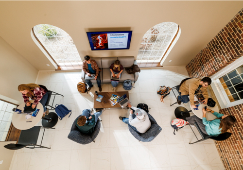 Aerial view of seven students studying in Nebraska Hall on the Milford Campus