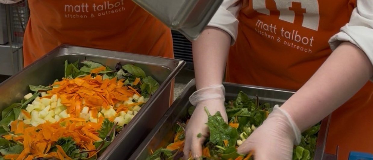 SCC Culinary students prepare a salad at Matt Talbot Kitchen & Outreach