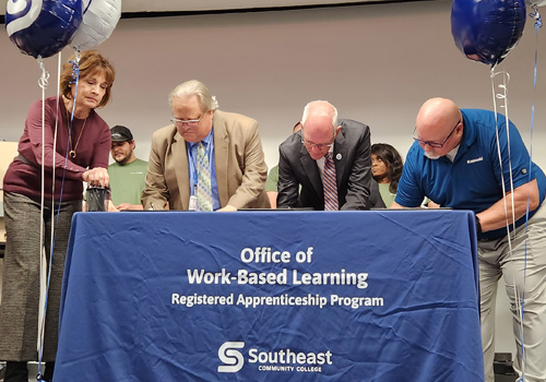 SCC and Kawasaki officials sign the apprenticeship agreement