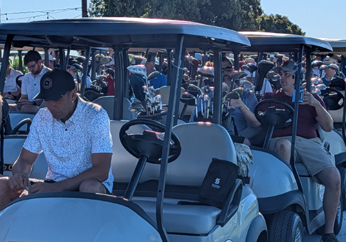Teams at the SkillsUSA Charity Classic are in their golf carts ready to go. 