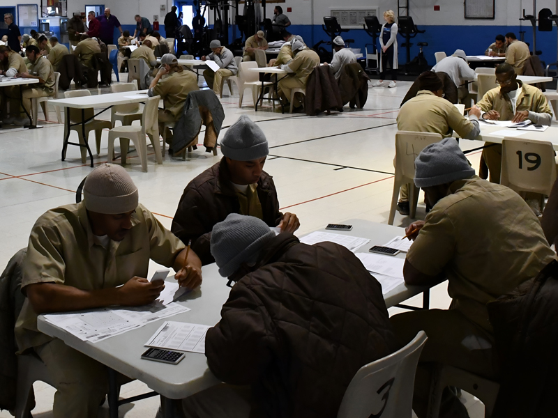 Students in the prison education program taking a test. 